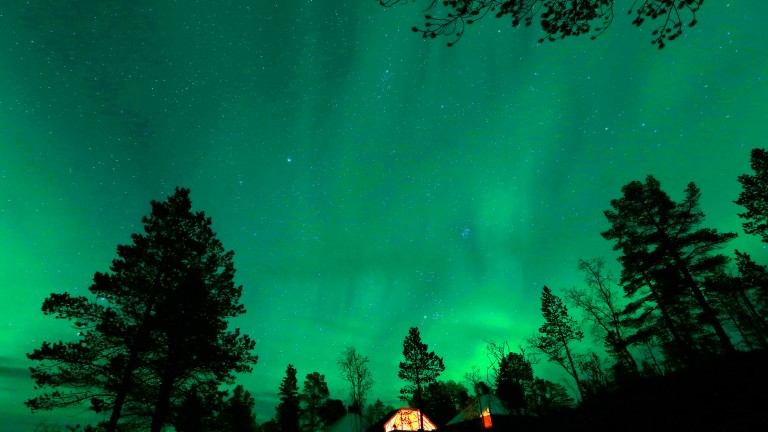 An Aurora Borealis (Northern Lights) is seen over a mountain camp north of the Arctic Circle, near the village of Mestervik 